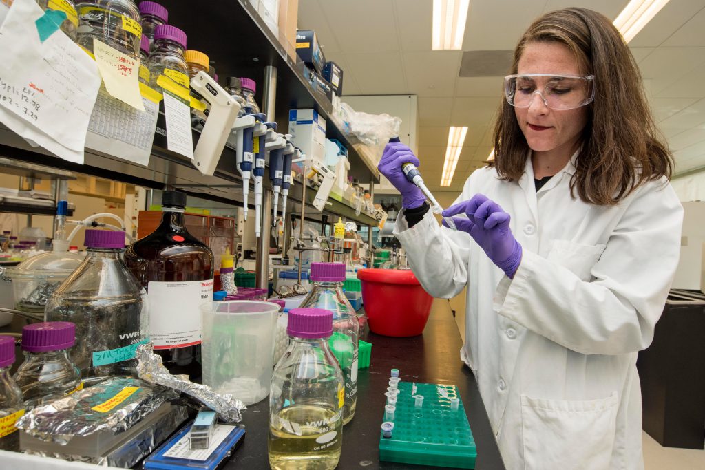 Female scientist works in a laboratory.